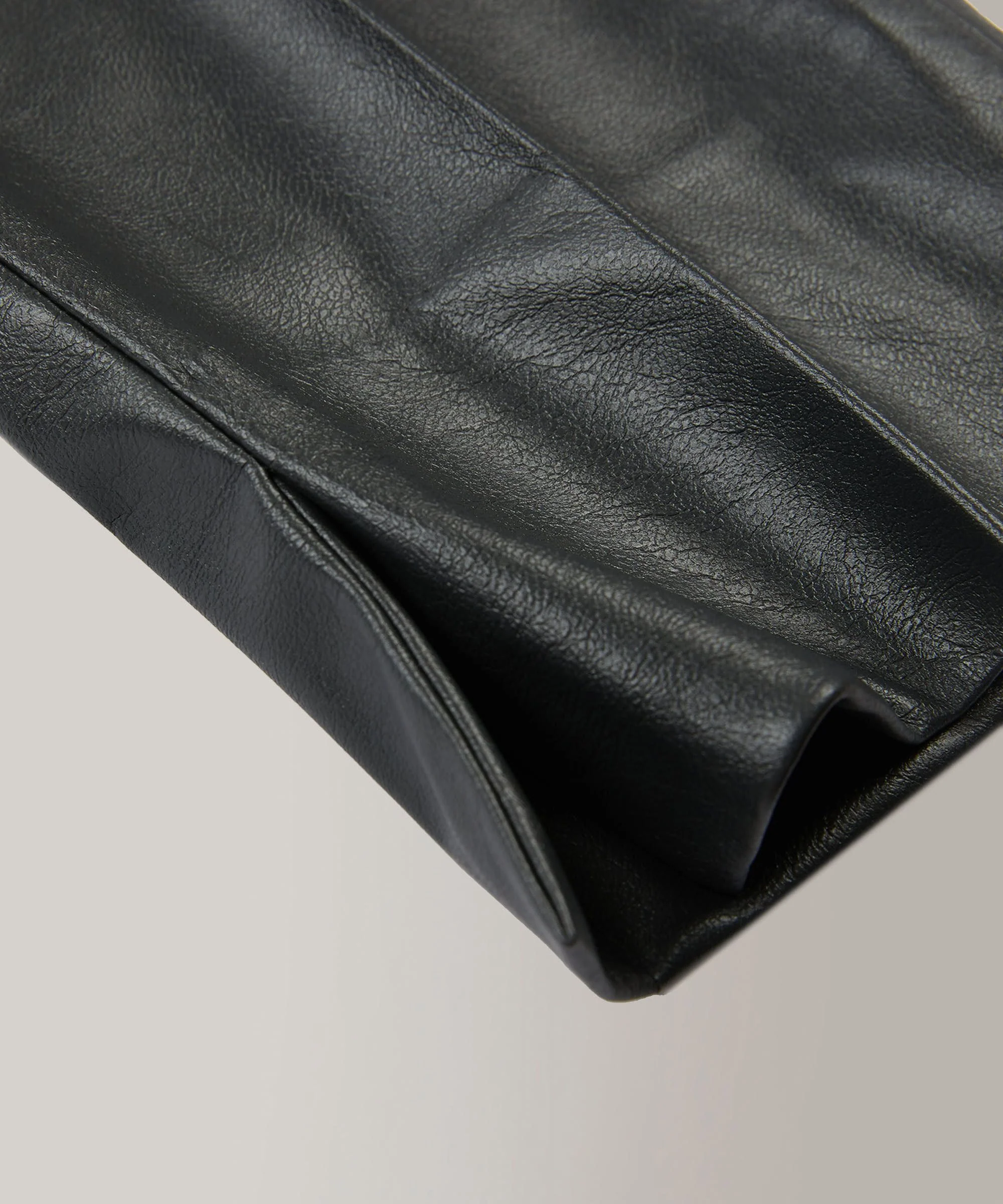 Slim-fit trousers in stretch faux leather - Image 7